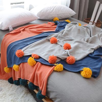 China Soft 100% Cotton Knit Colorblock Pom Pom Throw Blanket Super Soft Decorative Blanket Home Decor Wholesale for sale