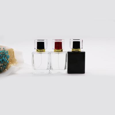 China Custom Black Color Square Shape Glass Cosmetic Perfume Bottle 30ml 50ml 100ml for sale