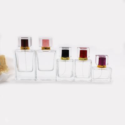 China High Quality Fancy Perfume Bottle 50ml Spray Glass Clear Refillable Bottle Cosmetic With Acrylic Cap for sale