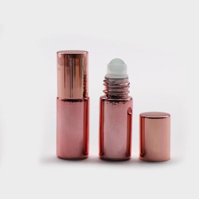 China Personal Care UV Electroplate Color Tube Glass Roll On Bottle 5ml 10ml Rollerball Oil Glass Perfume Bottle for sale