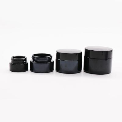 China Custom Luxury Black Cosmetic Cream Glass Cosmetic Jars 10g 20g 30g 50g With Plastic Lids for sale