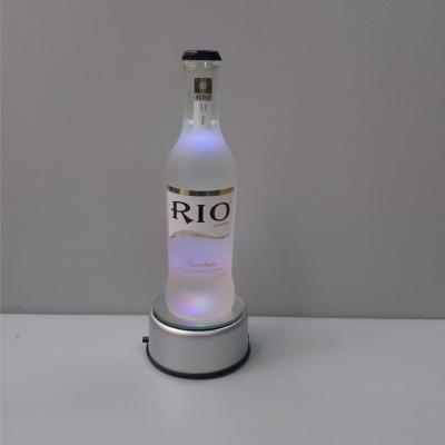 China Wholesale Rotating Round Silver Plastic Mirror Base Led Glorifying Light Bottle for sale