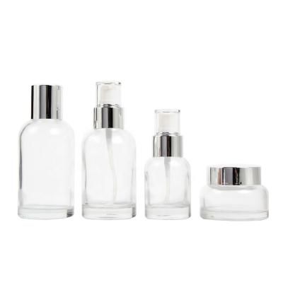 China Cosmetic luxury cosmetic bottle set pump bottle glass jar for package lotion body care cosmetic skin care products for sale