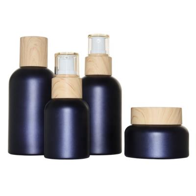 China Luxury Matte Blue Cosmetic Bottles 40ml 100ml 120ml 50g Cream Glass Cosmetic Bottles and Jars for sale