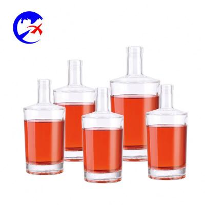 China 700ml Beverage Making Glass Wine Bottle With Cap For Spirits Whiskey Brandy Clear Bottle Glass for sale