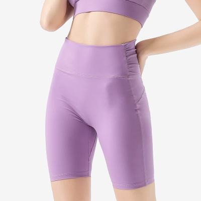 China Naked Yoga Fitness Clothes Breathable Five-Point Pants Women's Running Tight Waist High Cycling Pants Fishing Hip Sports Shorts for sale