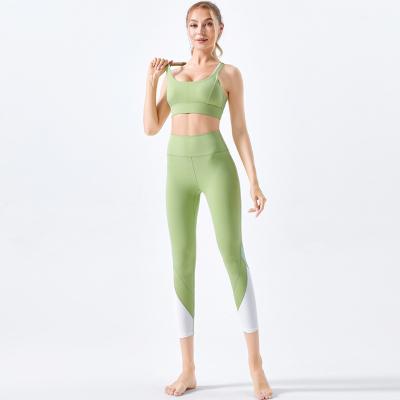 China New beautiful bra yoga pants female sports breathable two-piece colorimetric naked back suit running fitness suit for sale