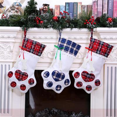 China Burlap Dog Christmas Stocking Personalized Plaid Paw Stocking Christmas Gift Bags Animal Stocking Ornaments for sale