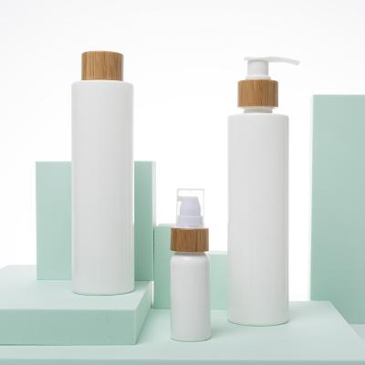 China Household Products PLA Environmental Biodegradable Cosmetic Packaging Bottle With Lid Bamboo Lotion Shampoo Conditioner Bottle for sale