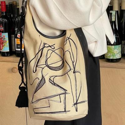 China Hot-selling high-grade women's bag retro shoulder bag wild graffiti literary large capacity tide casual bucket bag for sale