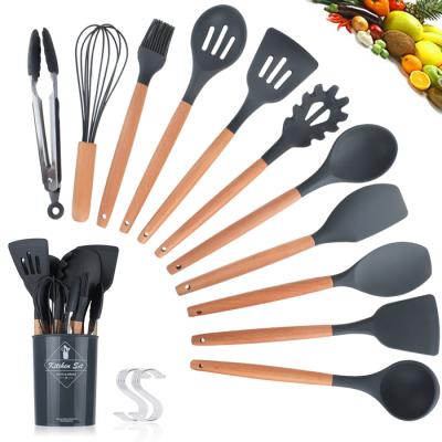 China Black Stocked 11pcs Cooking Silicone Food Grade Spatula Set With Plastic Heat Resistant Kitchen Handle Insulated Base Set for sale