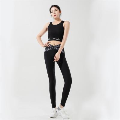 China Breathable The Latest Design Black Comfortable Fashion Yoga Suit With Cross-stripe Leggings Sports Fitness Suit for sale