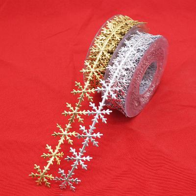 China New Gift Gold and Silver Snowflake Lace Embossed Double Sided Strap Christmas Decoration for sale