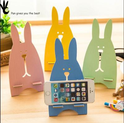 China Vintage Style Wooden Pan Phone Stand For Rabbit Shape Mobile Phone Stand for sale