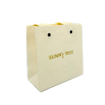 China Free Sample China Manufacturers Durable Foldable Antique Fashion Beige Paper Bag Jewelry Pouch for sale