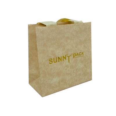 China Free Sample Durable Low Price Gold Style Logo Ribbon Beige Jewelry Packaging Luxury Paper Bag for sale