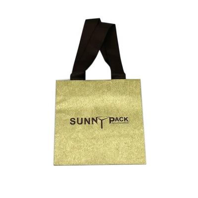 China Free Sample Wholesale Custom Logo Golden Small Gift Paper Bag Durable For Jewelry Box for sale