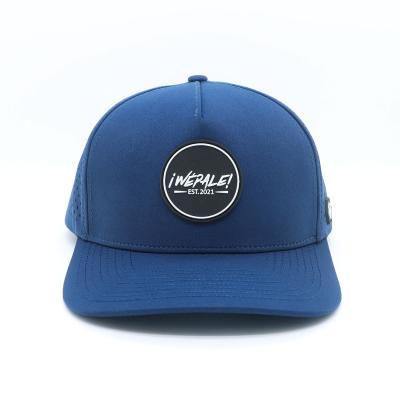 China Unisex Custom Navy Blue Baseball Cap with PVC Rubber Patch Logo and Waterproof Design for sale