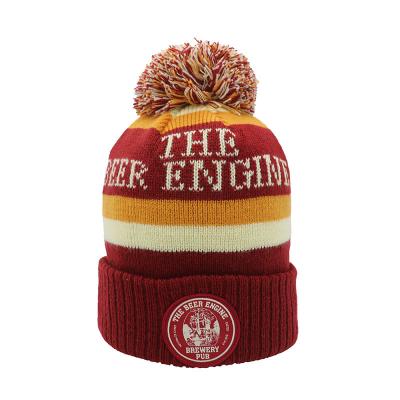 China Argyle Muster Strick Pom Pom Beanie für Männer mit gesticktem Gewebtem Label und benutzerdefinierten Kappen zu verkaufen