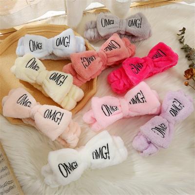 China Custom wholesale cute girls face fashion low MOQ logo wash bow Coral Fleece Headband plush headband letters for sale