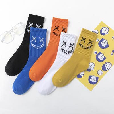 China Designer Tear Up Smiley Pattern Socks Unisex Breathable Sports Cotton Socks for sale