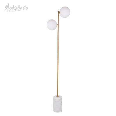 China Modern simple glass bulb floor lamp personality bedroom bedside living room sofa ball Nordic traditional floor lamp for sale