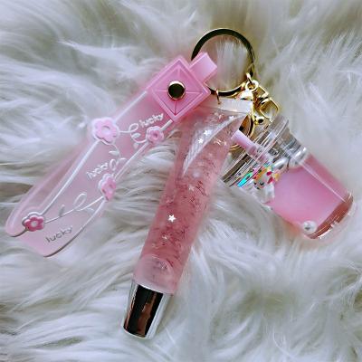 China Vegan Waterproof Cute Natural Pink Kids Lip Gloss Key Chain With Accessories Custom Packaging Low MOQ Lip Gloss Key Chain Private Label for sale