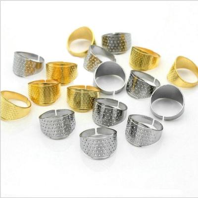 China DIY Tools Stitch Cloth Art Finger Thimble High Quality Sewing Cross Gold and Silver Ring Thimble for sale