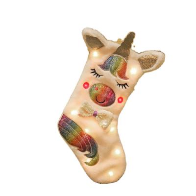 China Wholesale Lovely Colorful Christmas Decoration Unicorn Stocking Gift Bags LED Light Christmas Sock Candy Bag for sale