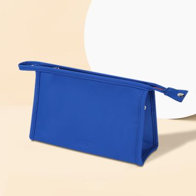 China Fashion Solid Color Toiletries Organizer Makeup Clutch Bag Outdoor Travel Woman Waterproof PU Wash Bag for sale