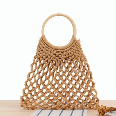 China Hip Hop Summer Solid Hollow Out Handmade Weave Round Handle Women's Retro Straw Net Beach Handbags Handbags for sale