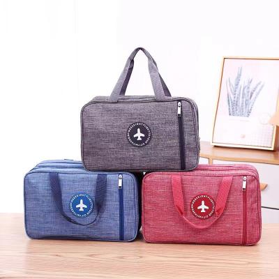 China Multifunctions Oxford Cloth Travel Organizer Bag Waterproof Hand Stored Cosmetics Bag Dustproof Wash Bag for sale