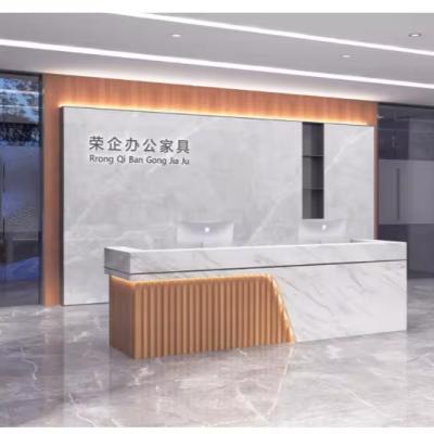 China Splicing 1029 Custom Luxury Wood Furniture Modern Design Work Desk Custom Logo Hotel Gym Hospital Beauty Salon Reception Desk for sale