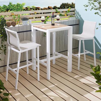 China Modern outdoor table bar aluminum table and modern teak living room balcony courtyard chair combination and chair three-piece set for sale