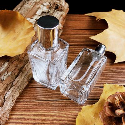 China Personal Care Porcelain Wholesale Luxury Cylinder Travel 20ml Empty Spray Perfume Glass Bottle With Pump Cap for sale