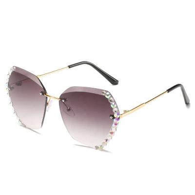 China Trendy Fashion Sunglasses Ladies New Diamond-studded Rimless Polygonal Sunglasses Edge Crystal Cut Sunglasses for sale