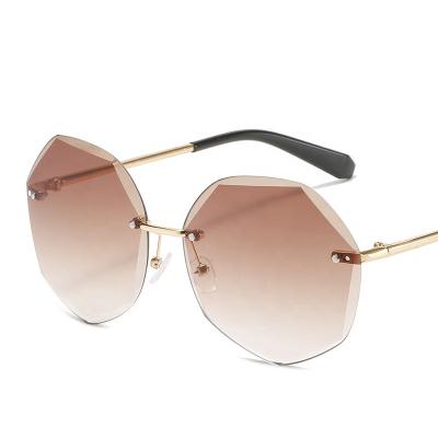 China Fashion sunglasses shape new big frame polygonal sunglasses shape rimless ocean colorful cut-edge metal frame sunglasses for sale