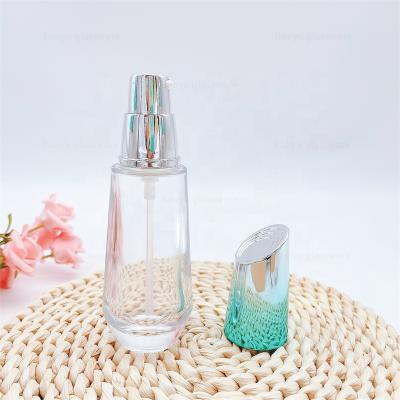 China Custom Packaging 50ML Skin Care Essential Oil Cosmetics Liquid Glass Bottle With Pump for sale