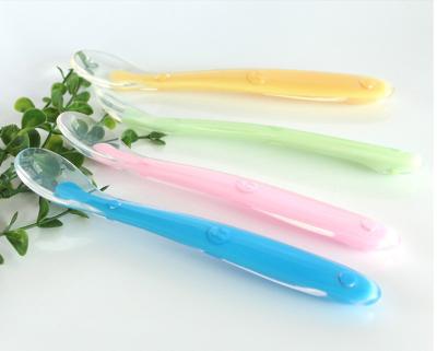 China Bpa Free Soft Purple Silicone Small Eco Baby Feeding Administer Spoon Training Eating Food Squeeze Spoon for sale