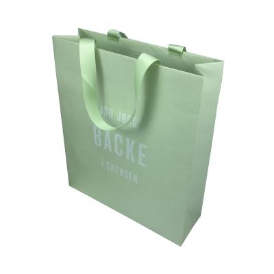 China Recycled Materials Recycling Logo Green Bouqtique Hand Embossed Luxury Paper Bag Clothes Shoes Shopping Packaging for sale