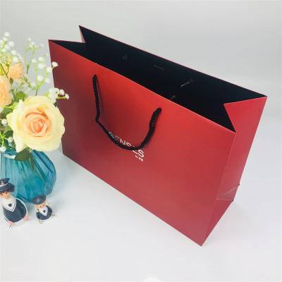 China Clothing Shoes Gift Packaging Luxury Retail Boutique Gift Packaging Bag Red Printed Paper Bag With Your Own Logo for sale