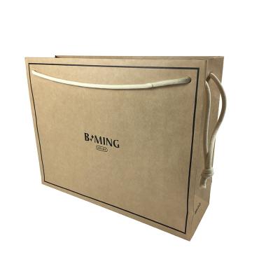 China Eco-Friendly Custom Biodegradable Brown Kraft Paper Men Women Clothes Tote Fashional Water Resistant Recycled Waterproof Paper Bags for sale