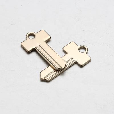 China Europe Manufacturer Design Metal Label Gold Color Key Shape Custom Lightweight Metal Tag for sale