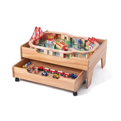 China Toy Onshine 2021 New Style 100pcs Slot Train Track Table With Storage Box Amusement Wooden Train Toy for sale