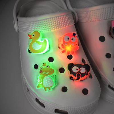 China Hot Selling LED Shoe Charm 2022 PVC Shoes Decoration LED Fang Charm Light Shoes Charm Decorations For Kids for sale