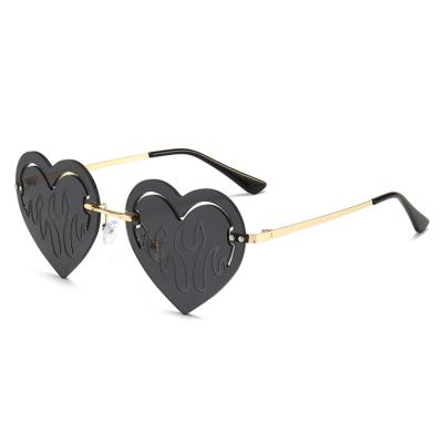 China Fashion sunglasses latest trend rimless cut love shine street photo sunglasses 2021 for sale