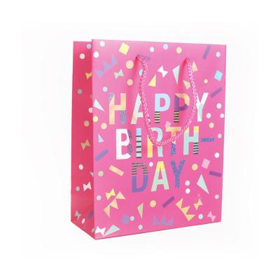 China Brand New Recyclable Luxury Custom Birthday Party Biodegradable Pink Paper Gift Bag With Handle for sale