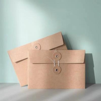 China paper & Factory Customized Hot Sale Cardboard Vintage Envelope Bag Kraft Paper Envelope With Drawstring Packing for sale