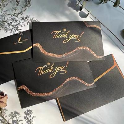 China paper & The carton factory produces black envelope bags with logo, and customized exquisite envelope bags for sale