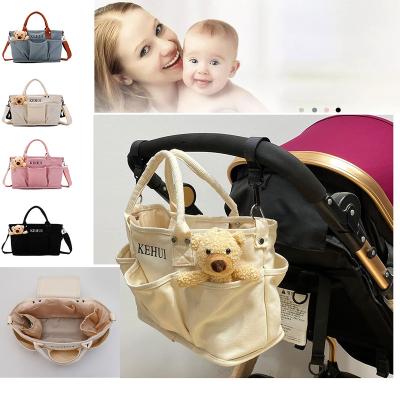 China Multifunctional WRAPPING BAG Fashion Stroller Mom Diaper Bag Baby Diaper Packing Bag Diaper Bag for sale